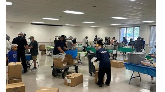 FBC volunteers participating in a food packing project