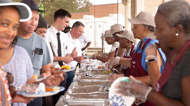 FBC volunteers serving meals in the community